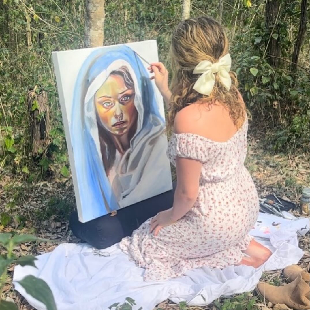 Alexa Stathakis painting Forgiveness outdoors